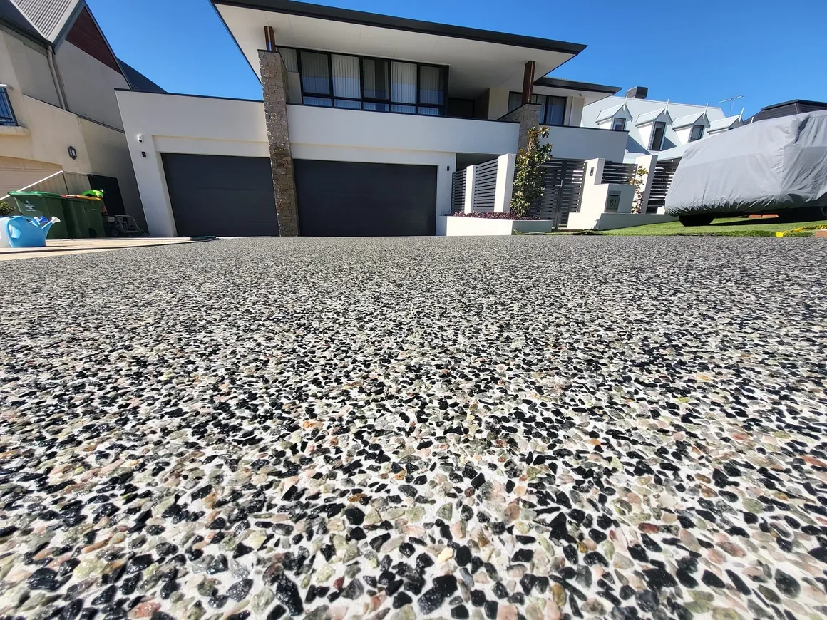 Close-up of a pebble exposed aggregate driveway finish